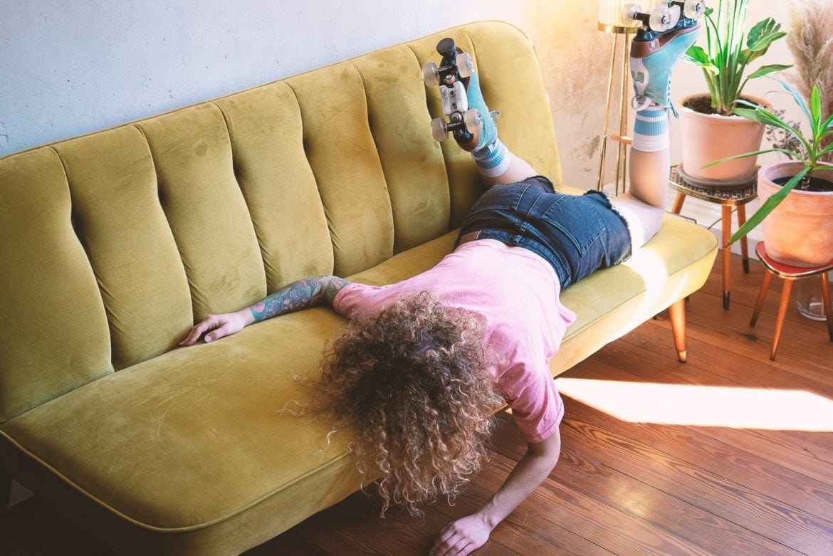 Skater lying on sofa