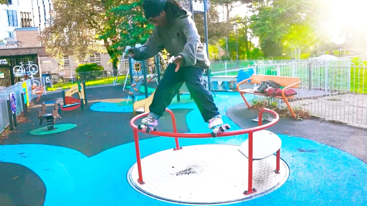 Skater Ryan Lowers performing a slide on a rail
